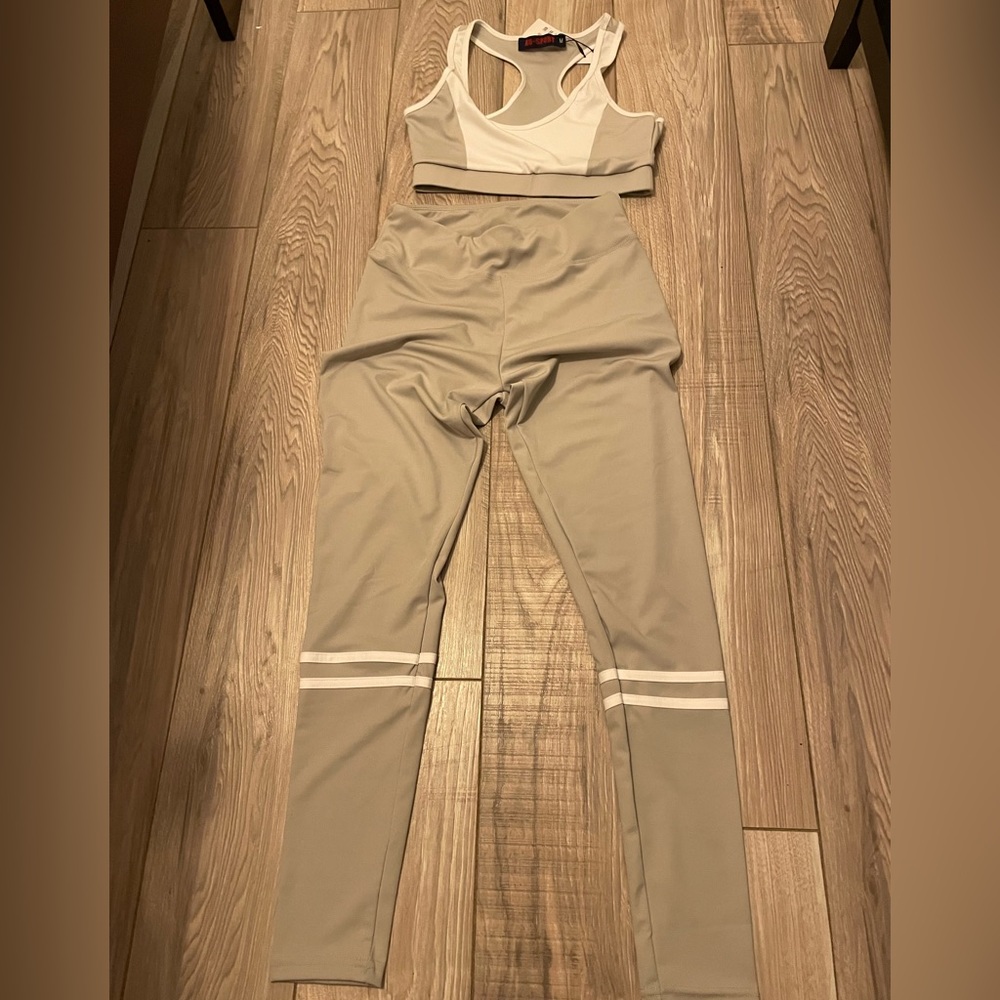 NWT 2 piece gray and white activewear set. White stripe leggings and sports bra